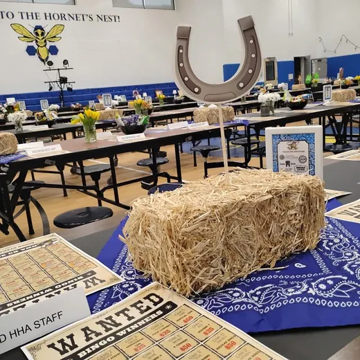 Hay bales, a horseshoe and bandana runners
