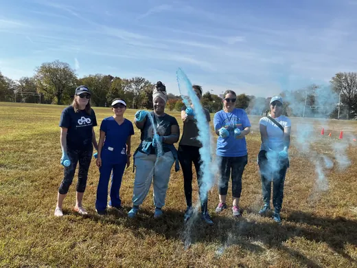 Volunteers launching blue powder