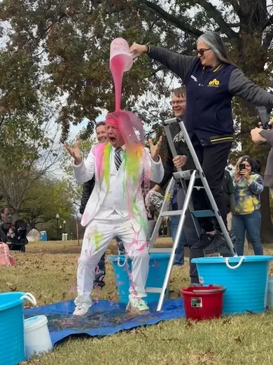 A pink wig and a full bucket