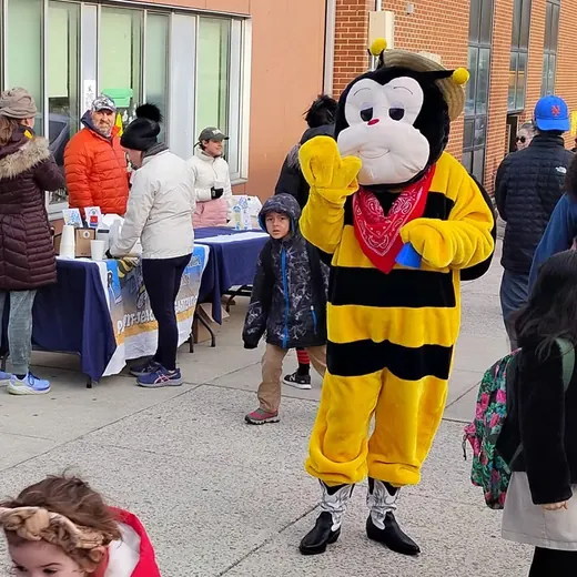 The mascot working the street