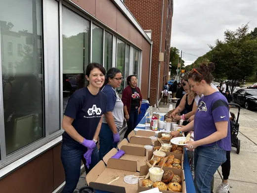 Volunteers serving food