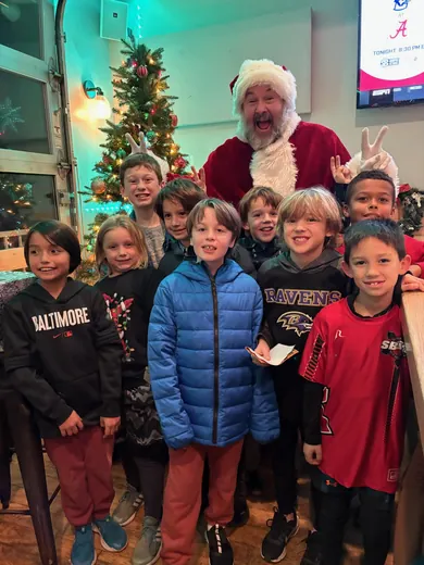 Santa with a crowd of Hornets