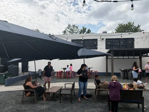 Families gathered under the umbrellas