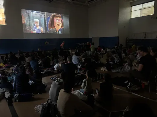 A packed gym watching the movie
